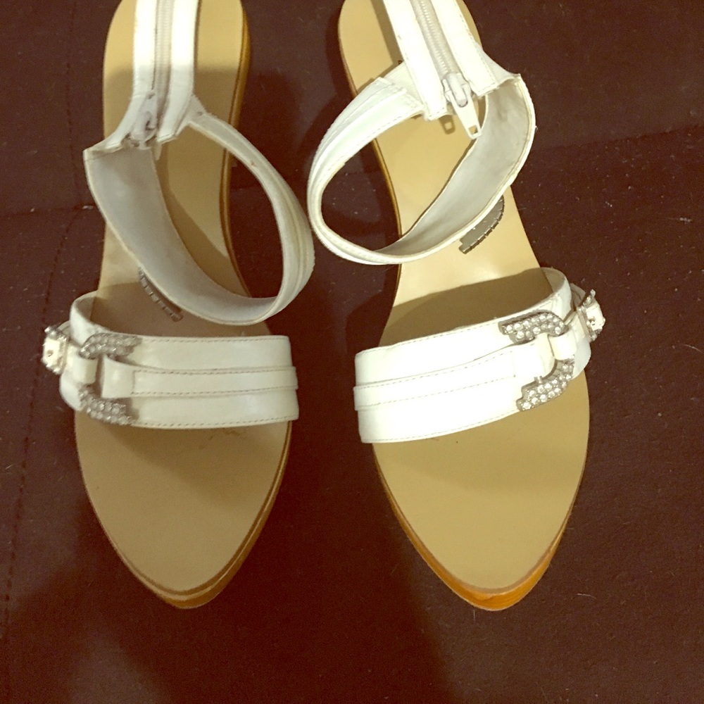 White shoes with silver heels.